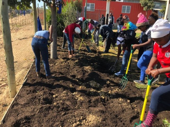 Members of Project Lima using Quality Gardening Tools Donated by Lasher
